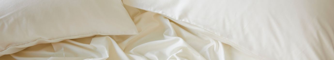 Close-up of Ivory bamboo bedding with pillows and duvet