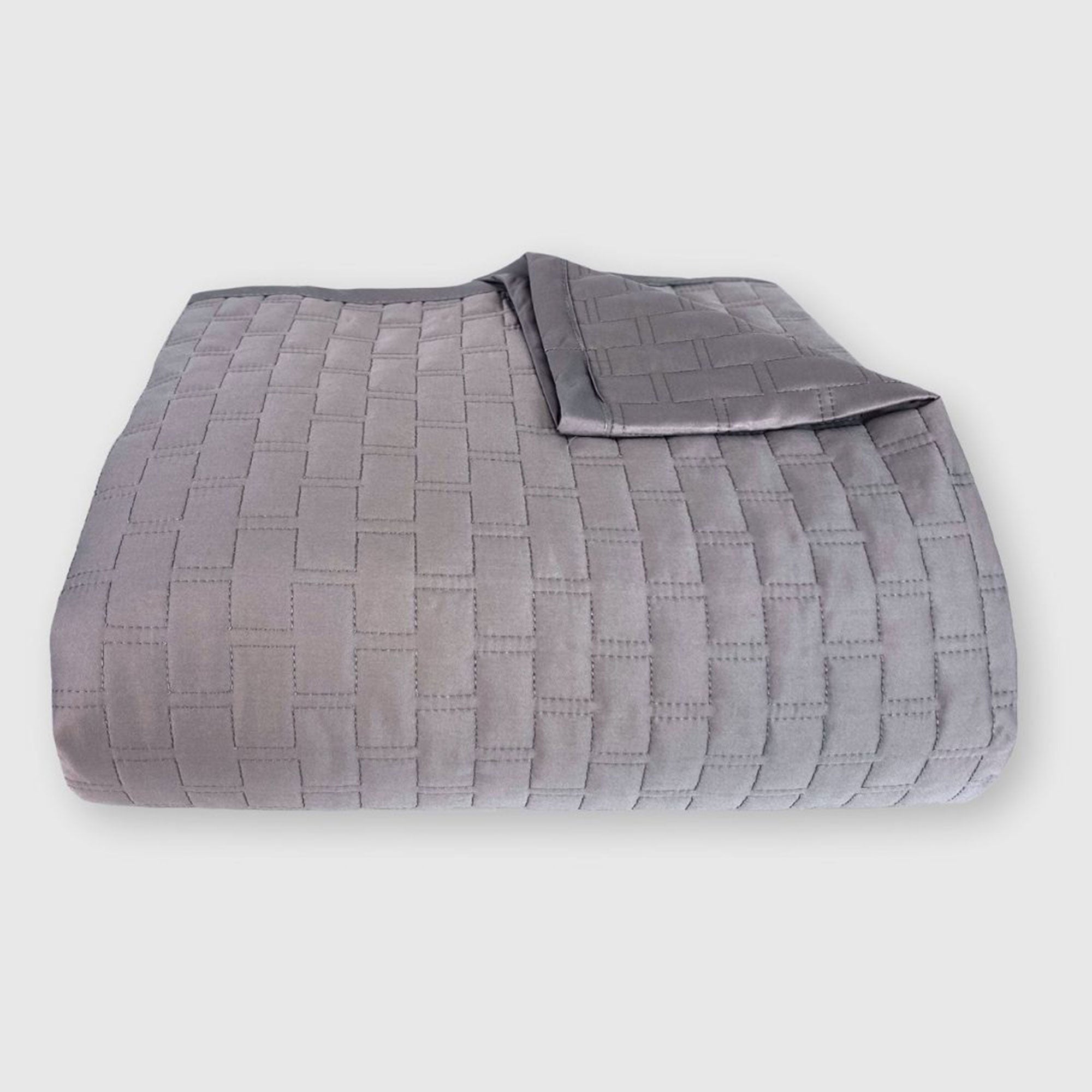 dark gray platinum bamboo quilted coverlet elegantly folded with brick pattern