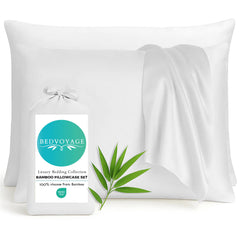 White bamboo pillowcases with a green leaf and Bedvoyage label on a white background