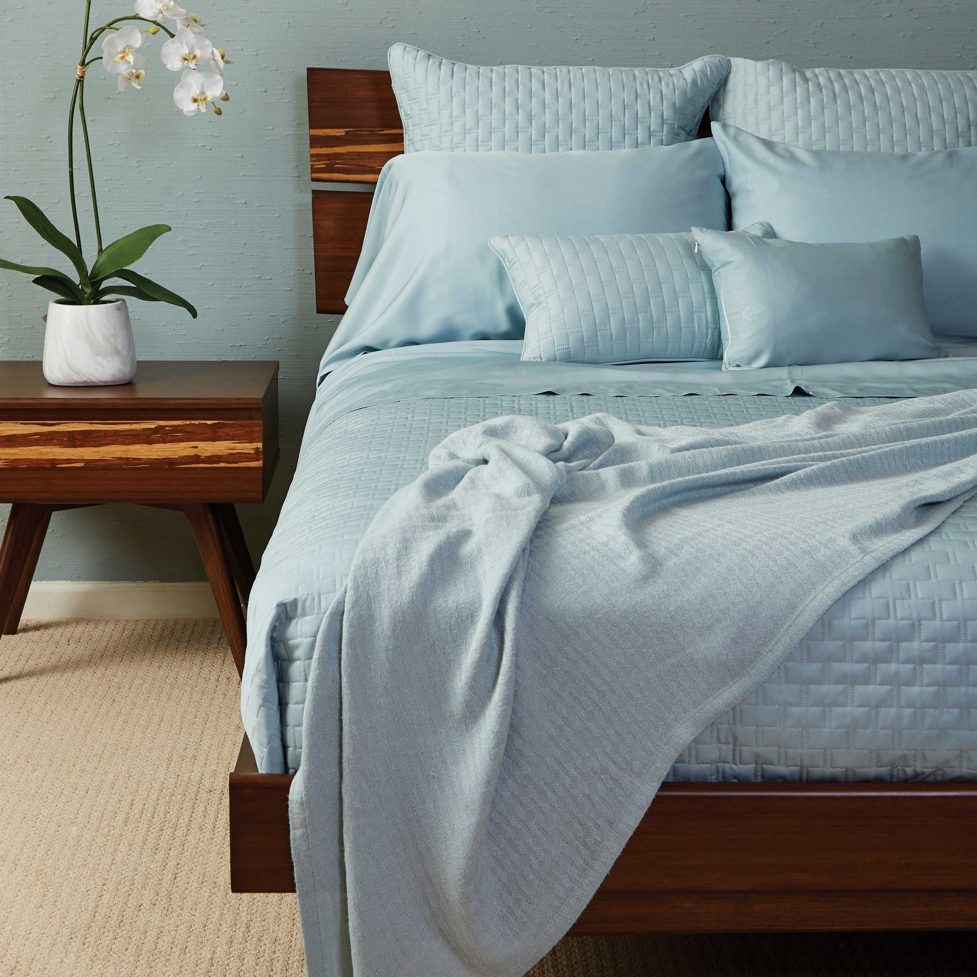 light blue sky bamboo quilted coverlet on a gorgeous bamboo bed frame bedroom