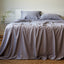 platinum gray silky bamboo bed sheet set and pillows on a bed