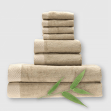 8 piece tan champagne bamboo towel stack showing basket weave edge and a bamboo plant
