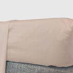 champagne beige fitted sheet on a mattress