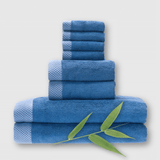 8 piece dark blue indigo bamboo towel stack showing basket weave edge and a bamboo plant
