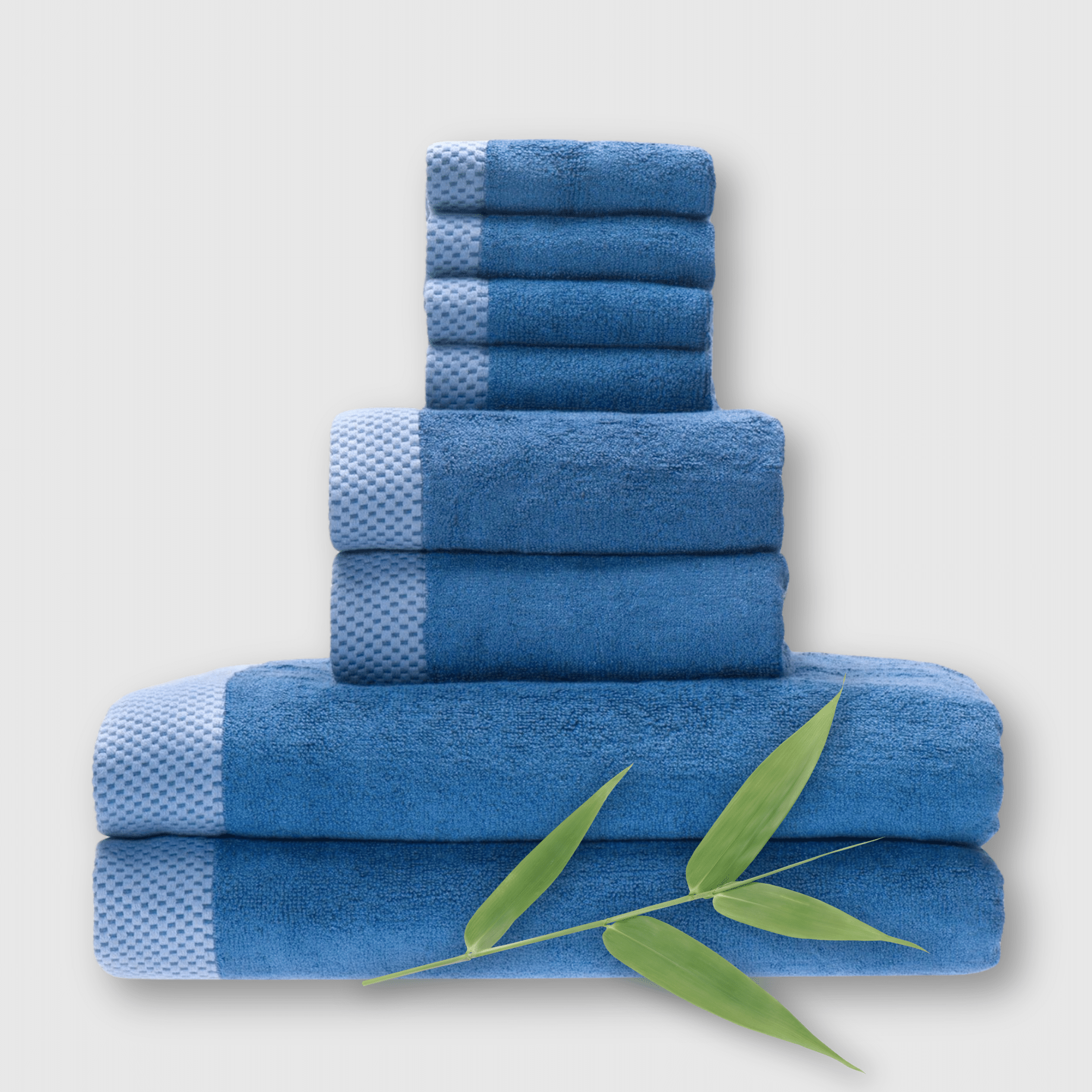 8 piece dark blue indigo bamboo towel stack showing basket weave edge and a bamboo plant