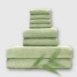 8 piece sage green bamboo towel stack showing basket weave edge and a bamboo plant