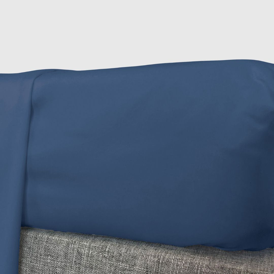 indigo blue fitted sheet on a mattress