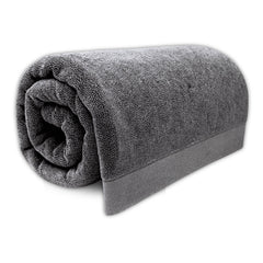 Rolled-up gray towel on a white background