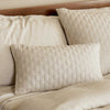 beige sand melange bamboo quilted decorative throw pillow on bed
