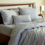 silver gray melange bamboo duvet dover and pillows on a made bed