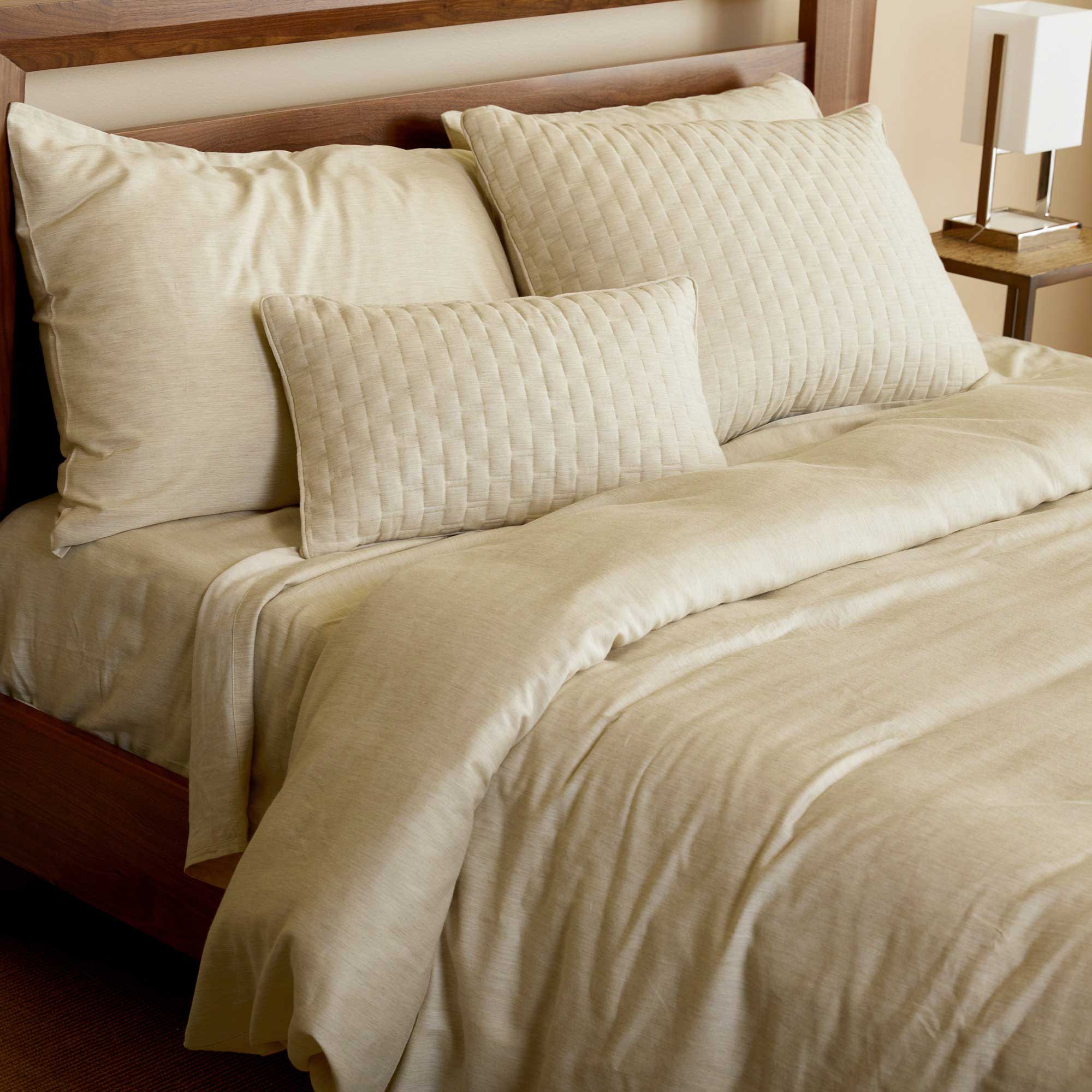 sand beige bamboo melange duvet cover and standard shams on a bed