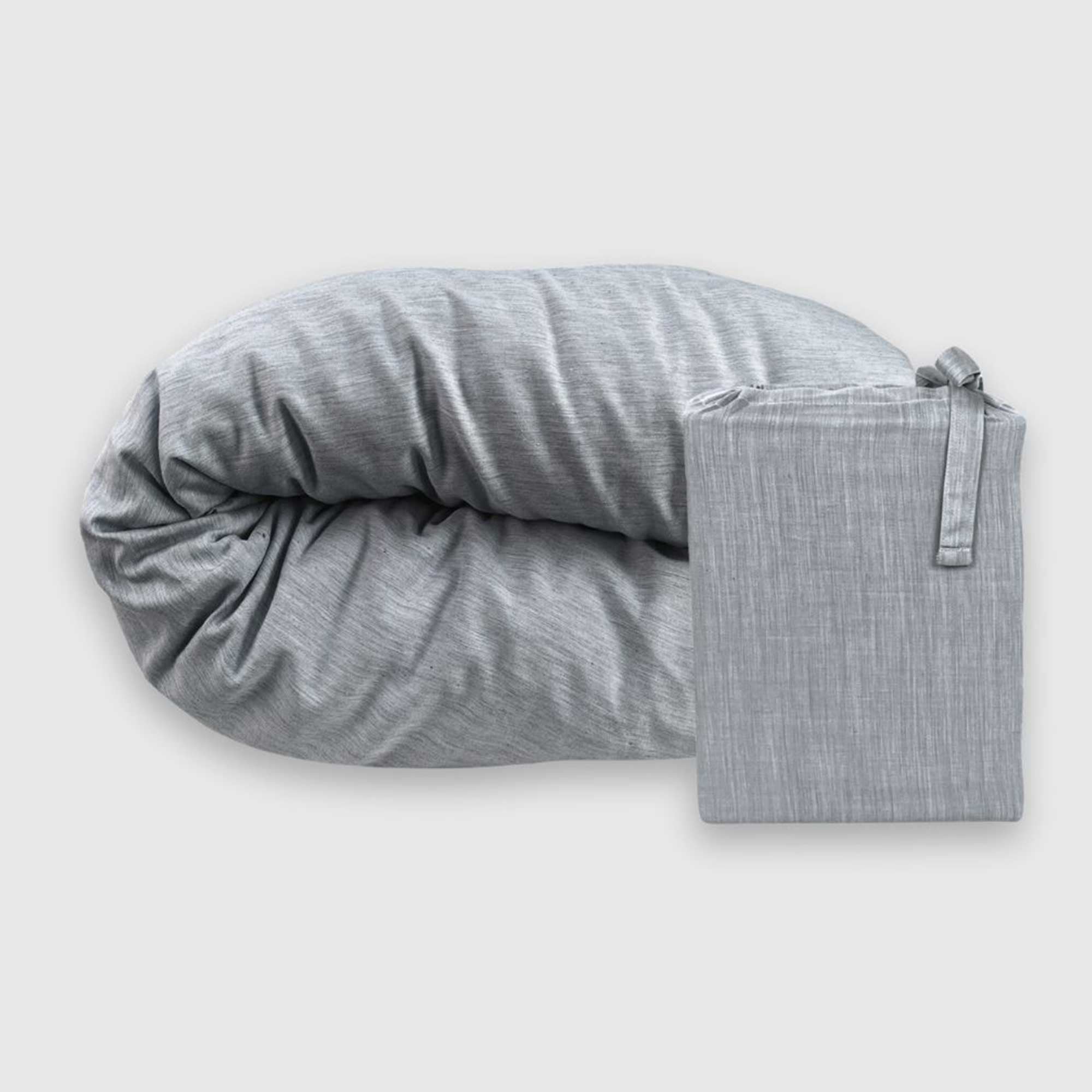 folded silver gray melange bamboo duvet cover and linen storage bed