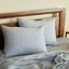silver gray quilted melange bamboo standard shams on a bed
