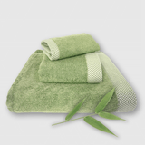 sage green 3 piece bamboo towel stack with bamboo plant