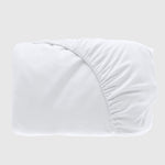 folded white bamboo fitted sheet with fitted elastic showing