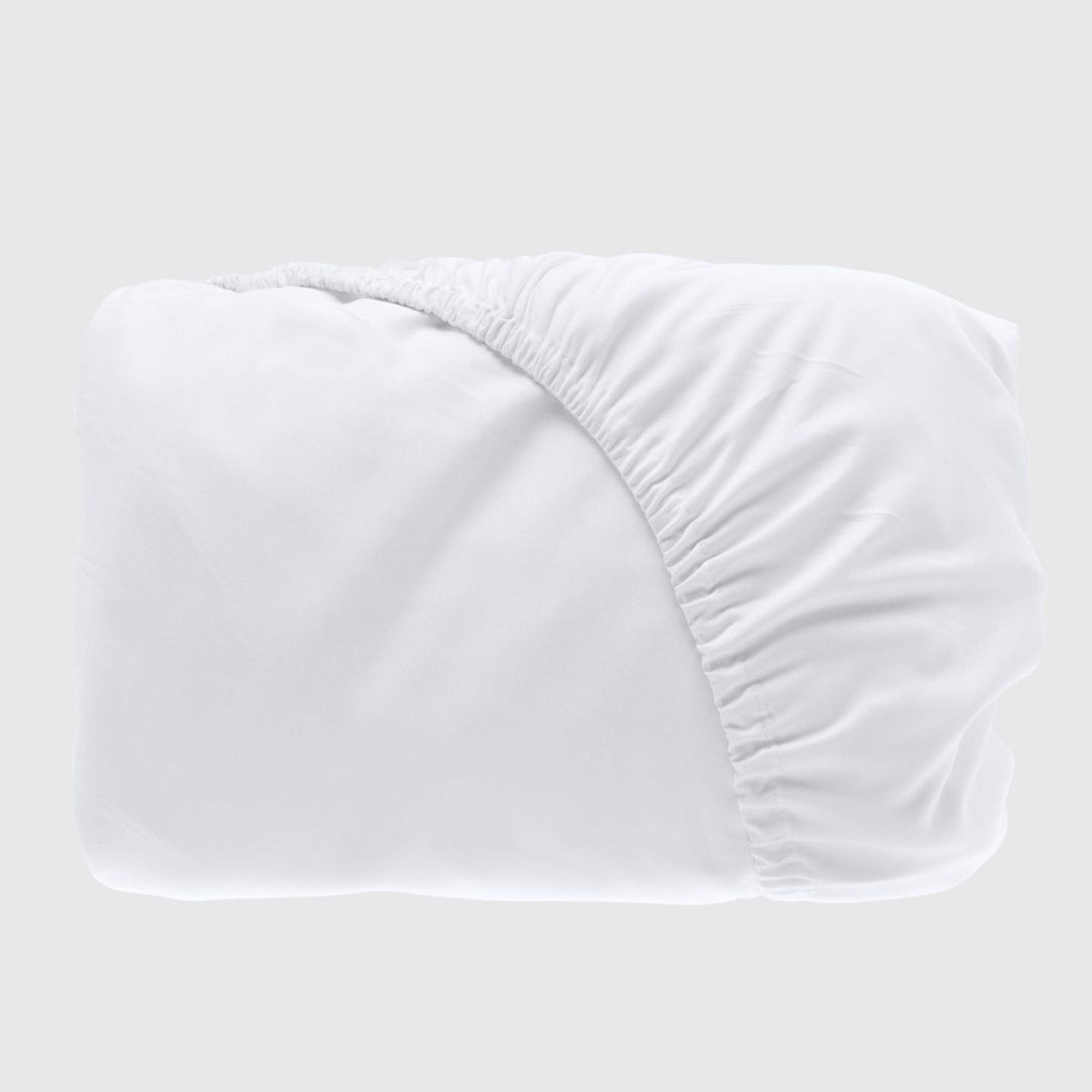 folded white bamboo fitted sheet with fitted elastic showing
