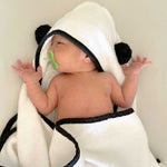 infant boy wrapped in bamboo hooded bath towel with panda ears
