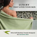 Woman holding a green towel with text about ultra-soft bamboo towels for sensitive skin.