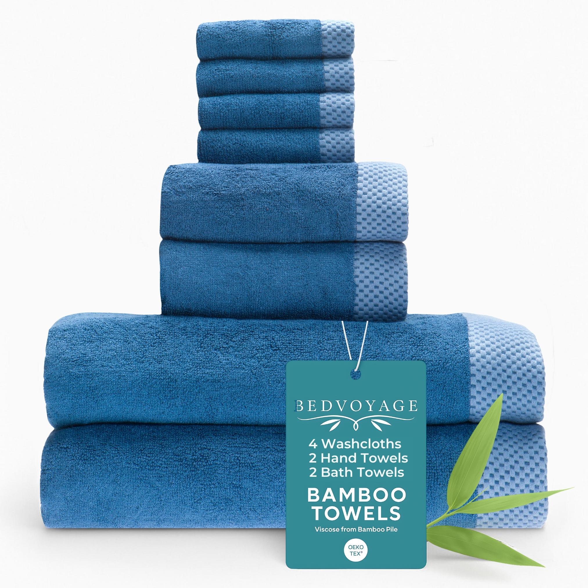 Set of blue bamboo towels with a 'Bed Voyage' tag on a white background