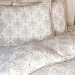 Patterned bed sheets and pillows on a bed