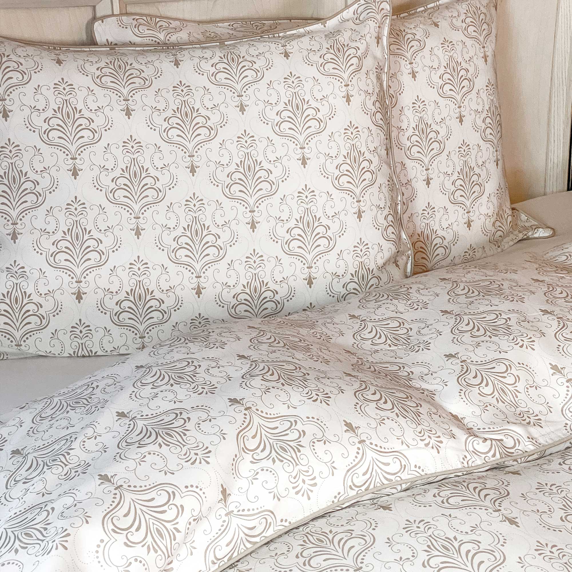 Patterned bed sheets and pillows on a bed