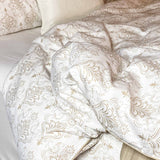 tan and beige damask bamboo duvet cover messy on bed
