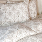 Patterned bed sheets and pillows on a bed