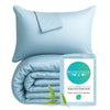 light sky blue duvet cover and shams stacked with a packaging back on white background