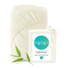 Ivory fitted sheet with BEDVOYAGE label and bamboo leaf on a white background