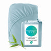 Light blue bamboo fitted sheet with Bed Voyage packaging on a white background