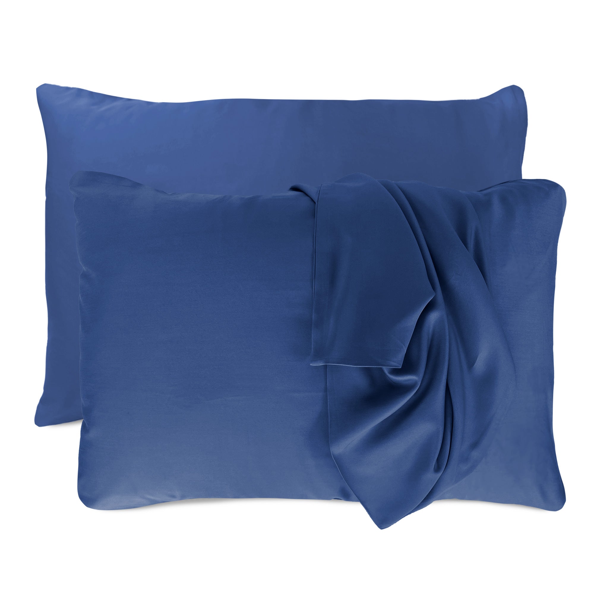 dark blue indigo pillowcases set with floating pillows and one pillowcase is draped over a pillow