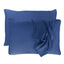 dark blue indigo pillowcases set with floating pillows and one pillowcase is draped over a pillow