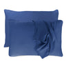 dark blue indigo pillowcases set with floating pillows and one pillowcase is draped over a pillow