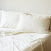 ivory bamboo pillowcases and sheet set on a bed