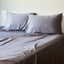 platinum bamboo pillowcases and sheet set on a bed