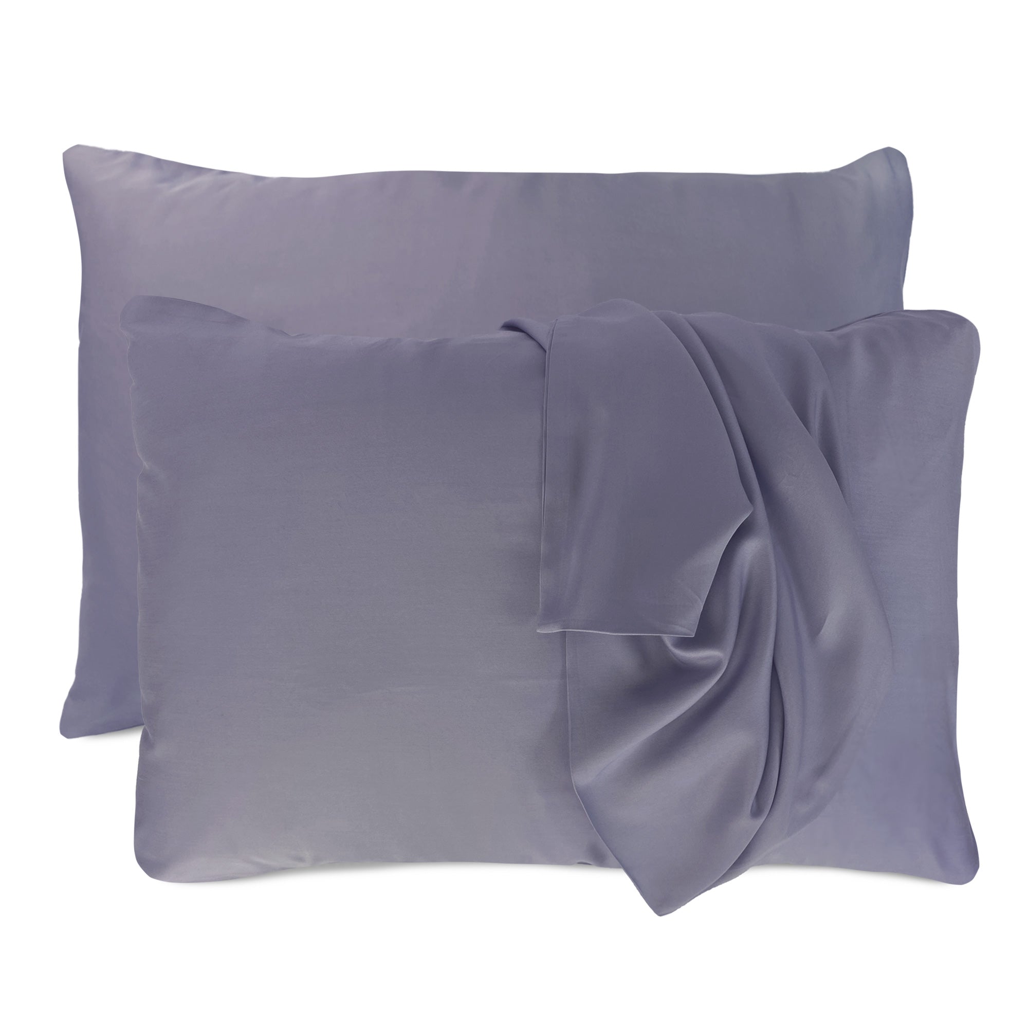 dark gray platinum pillowcases set with floating pillows and one pillowcase is draped over a pillow