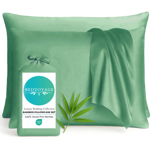 Green bamboo pillowcases with a Bedvoyage label on a white background