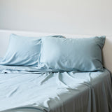 sky bamboo pillowcases and sheet set on a bed