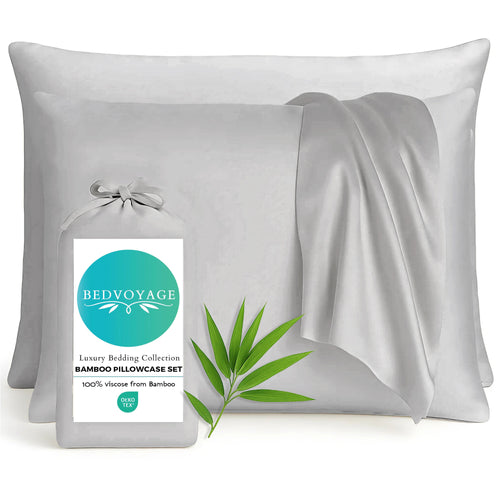 Gray bamboo pillowcases with a Bedvoyage label and green leaf on a white background