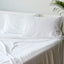 white bamboo pillowcases and sheet set on a bed