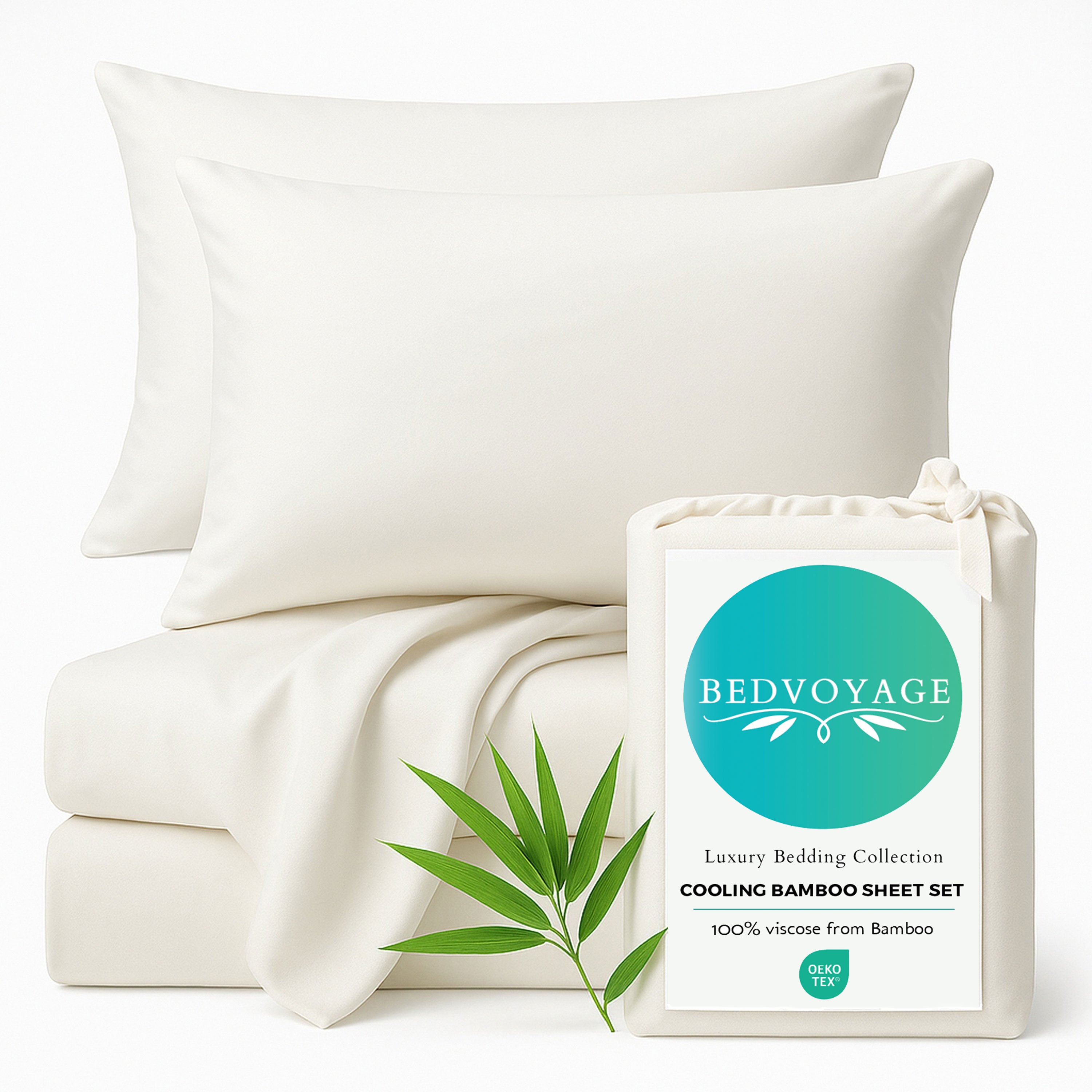 Ivory bamboo bed sheets stack with pillows sitting on a white background with packaging bag and bamboo leaf 