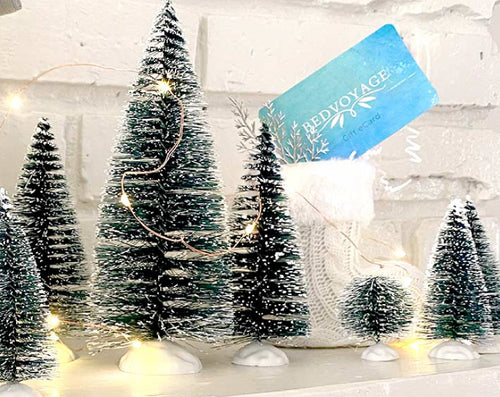 holiday bedvoyage gift card with mini christmas trees and lights