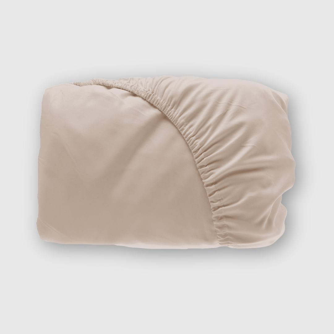 beige bamboo fitted sheet shown folded with elastic