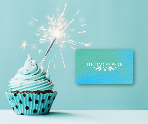 blue cupcake with sparkler and bedvoyage egift card