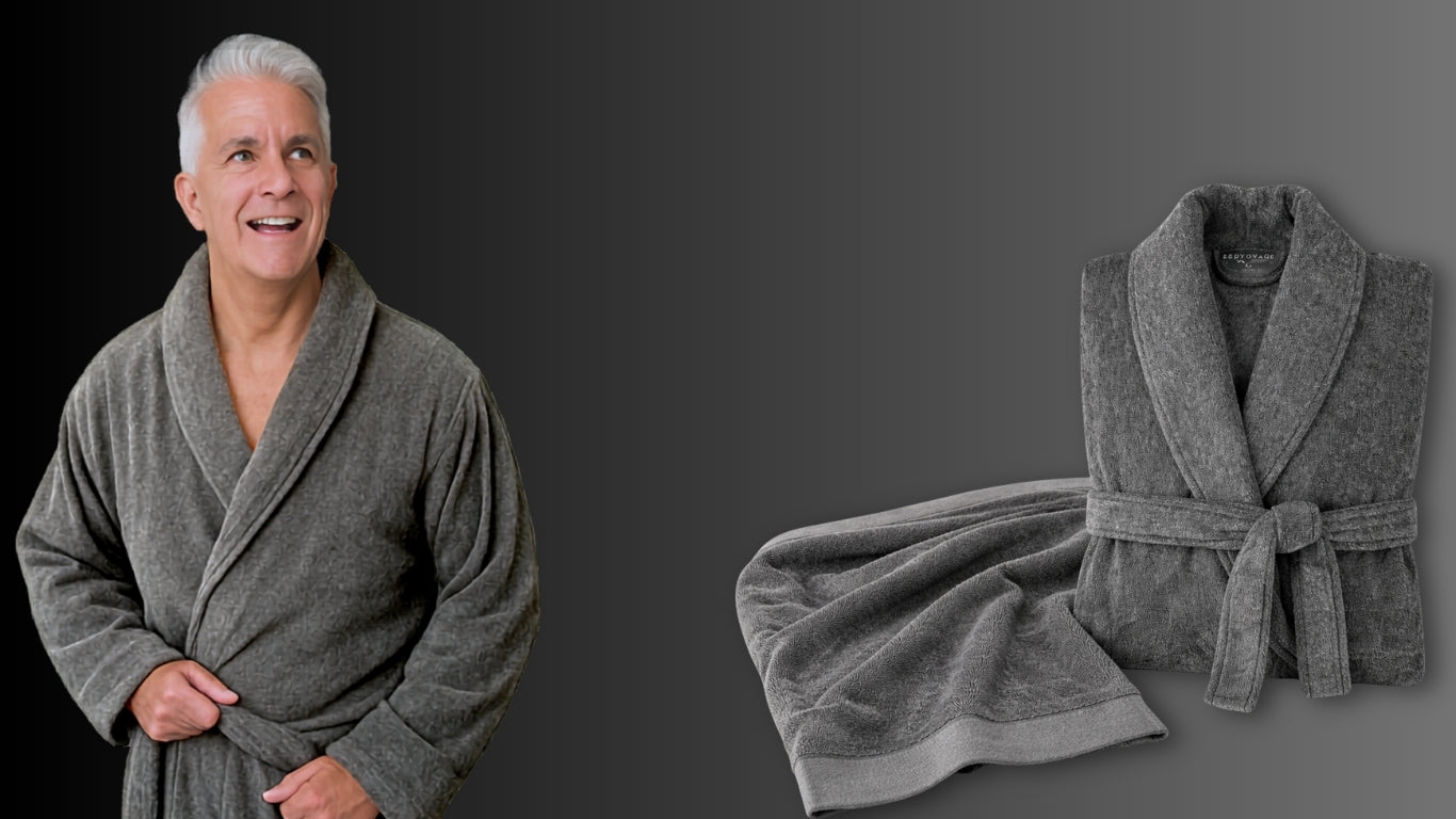 Man wearing a gray robe with an additional robe draped over a surface on a dark background