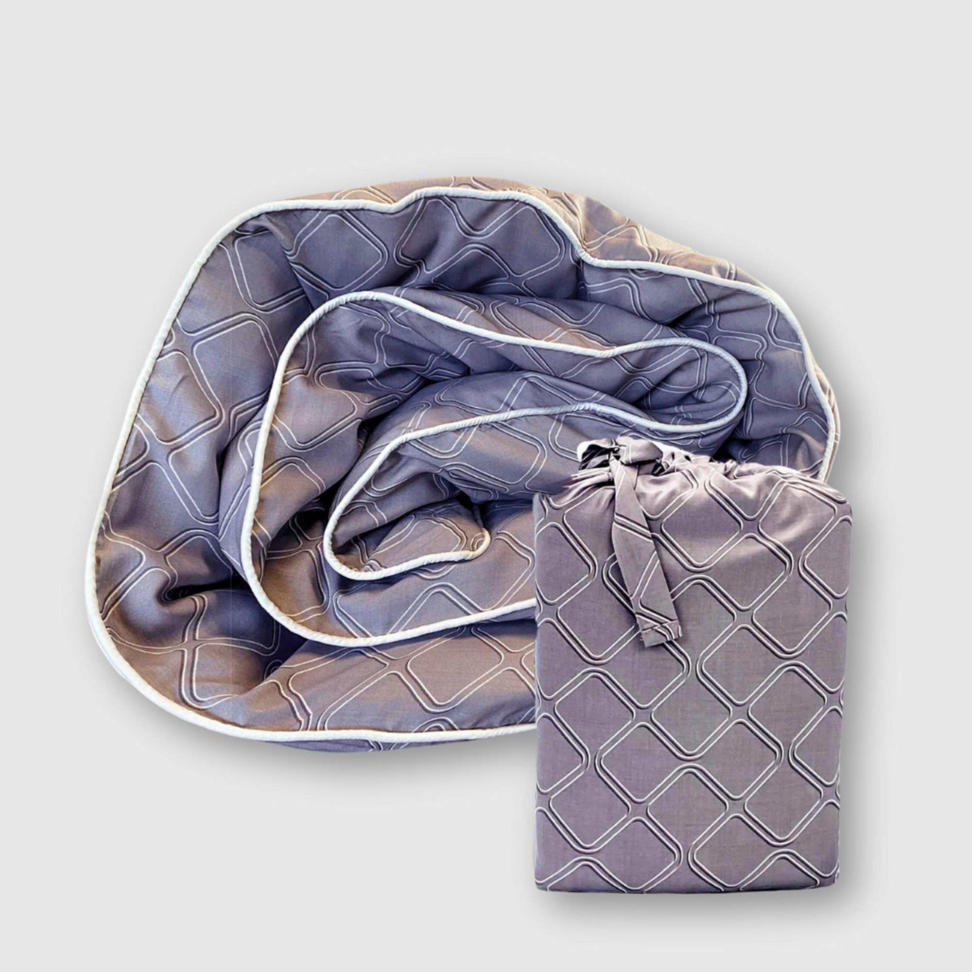 rolled dark gray platinum bamboo duvet cover with geometric pattern and linen storage bag