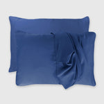 dark blue indigo bamboo pillowcase set with floating pillows and draped pillowcase