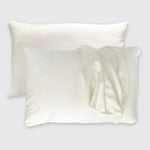 ivory bamboo pillowcases with pillow and pillowcase draped over it