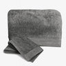 Gray towel set with folded and unfolded towel on a white background