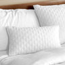 snow white melange bamboo decorative pillow sham on a bed with brick pattern